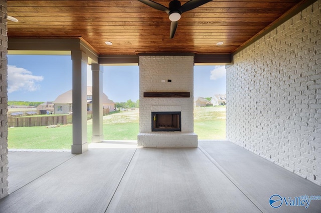 22938 Gunner Cir, Athens, AL 35613 - view of patio / terrace featuring an outdoor brick fireplace, a ceiling fan, and a residential view