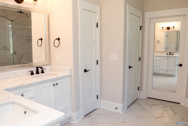 bathroom featuring an enclosed shower, tile patterned floors, and double sink vanity