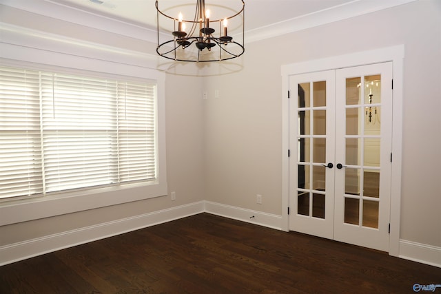 empty room with a wealth of natural light, french doors, and hardwood / wood-style floors