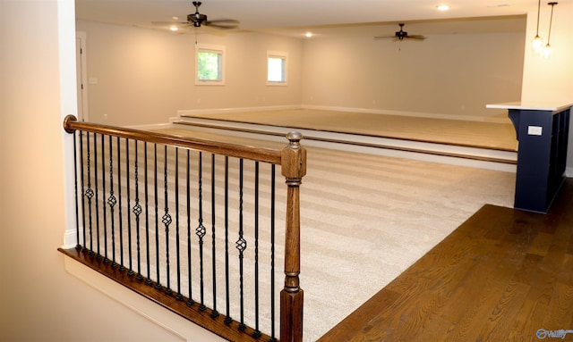 interior space featuring carpet and ceiling fan