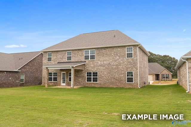 rear view of property with a patio area and a lawn