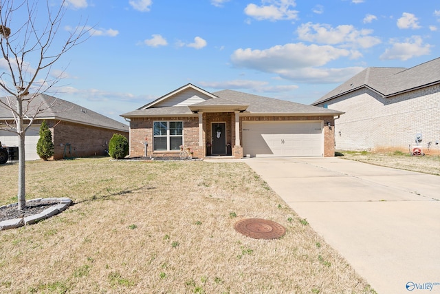 single story home featuring a shingled roof, concrete driveway, an attached garage, brick siding, and a front yard