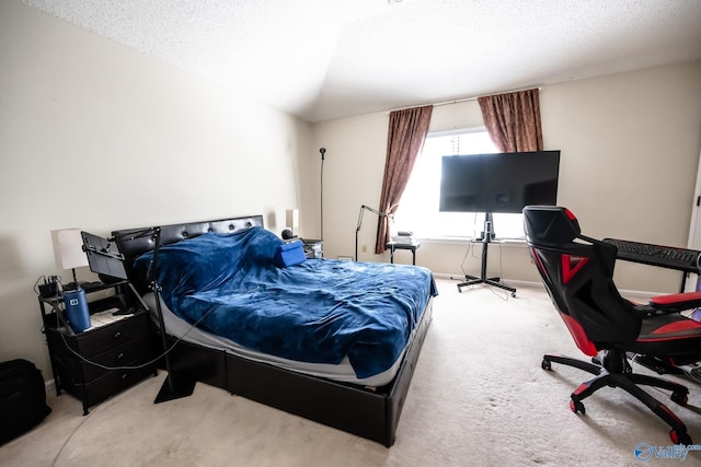 carpeted bedroom featuring lofted ceiling and a textured ceiling