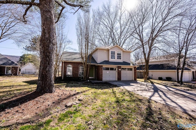 view of front of house featuring concrete driveway, brick siding, fence, and an attached garage