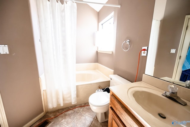 bathroom featuring toilet, visible vents, vanity, tile patterned floors, and a bathtub