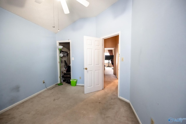 unfurnished bedroom with carpet floors, lofted ceiling, and baseboards