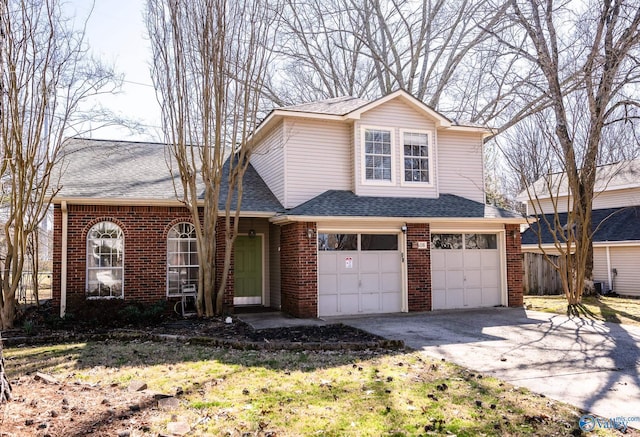 traditional-style home featuring brick siding, driveway, an attached garage, and roof with shingles