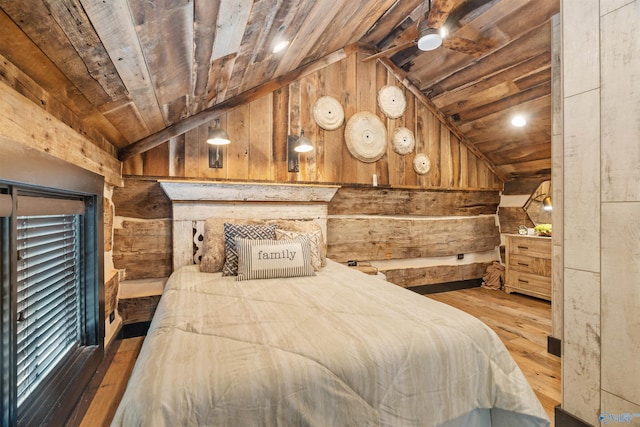 511 Pine Island Cir, Scottsboro, AL 35769 - bedroom with lofted ceiling, wood walls, wooden ceiling, and hardwood / wood-style flooring
