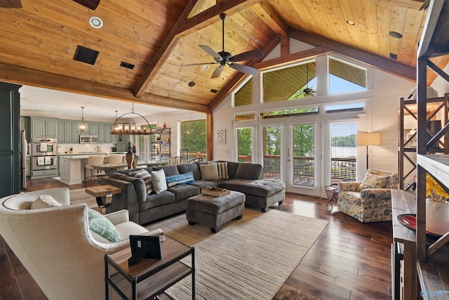 511 Pine Island Cir, Scottsboro, AL 35769 - living room featuring a ceiling fan, wooden ceiling with exposed beams, high vaulted ceiling, dark wood-style flooring, and a chandelier