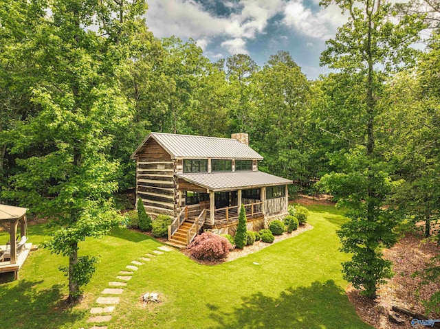 511 Pine Island Cir, Scottsboro, AL 35769 - back of house with a chimney, a standing seam roof, a yard, and metal roof