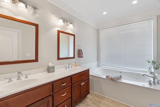 511 Pine Island Cir, Scottsboro, AL 35769 - full bathroom featuring crown molding, double vanity, a bath, and recessed lighting