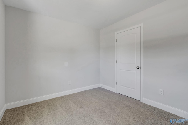 unfurnished room with carpet flooring