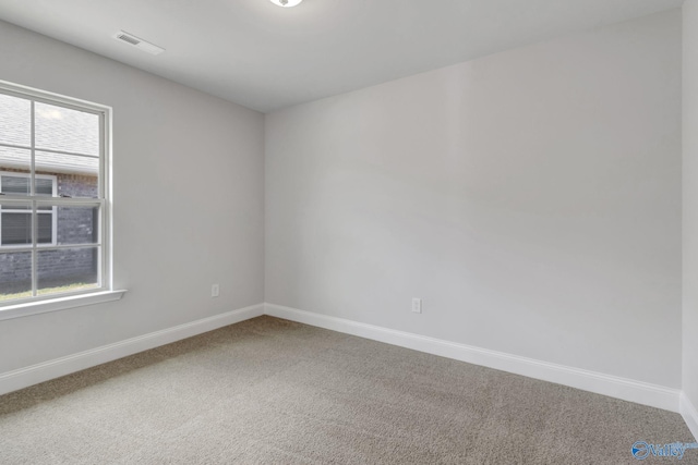 empty room featuring carpet flooring