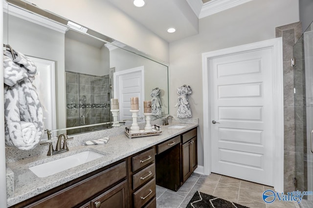 bathroom with vanity, crown molding, and walk in shower