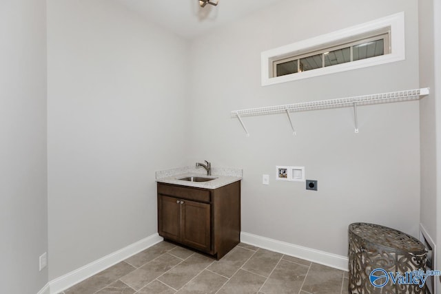 clothes washing area with electric dryer hookup, sink, light tile patterned floors, and washer hookup