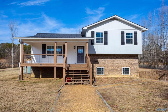 split level home with a porch and a front yard