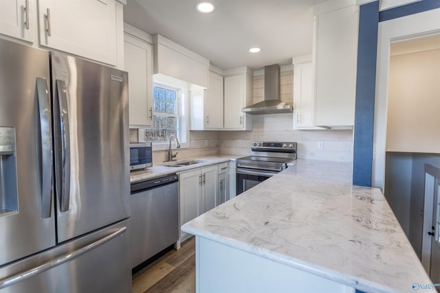 kitchen featuring stainless steel appliances, sink, decorative backsplash, dark wood-type flooring, and wall chimney exhaust hood