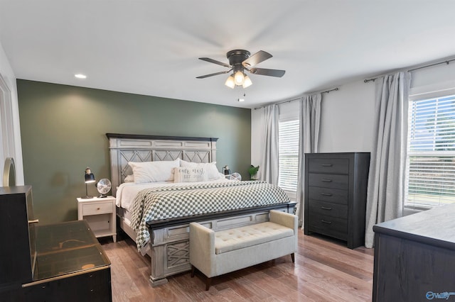 bedroom featuring ceiling fan and hardwood / wood-style flooring