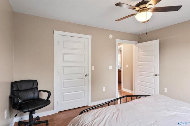 bedroom with hardwood / wood-style flooring and ceiling fan