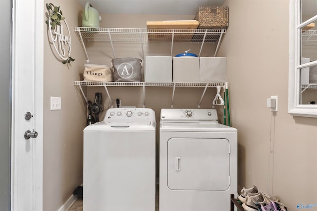 laundry room with independent washer and dryer