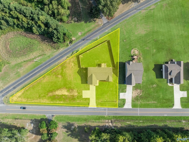 birds eye view of property with a rural view