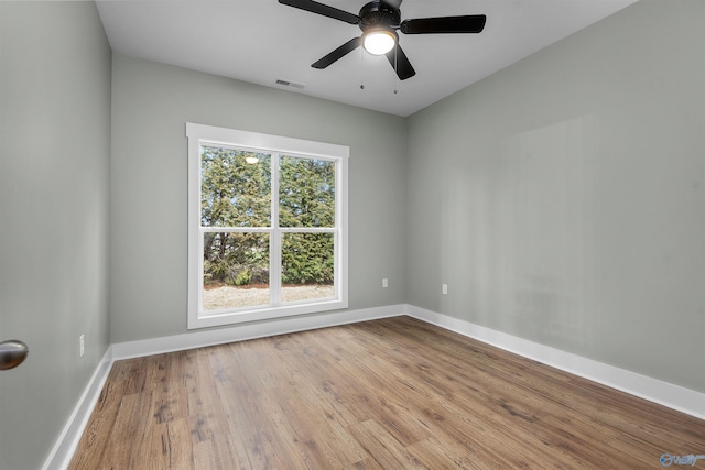 unfurnished room featuring ceiling fan and light hardwood / wood-style floors