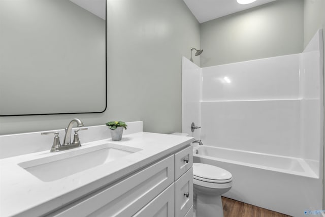 full bathroom with shower / bathtub combination, vanity, toilet, and wood-type flooring