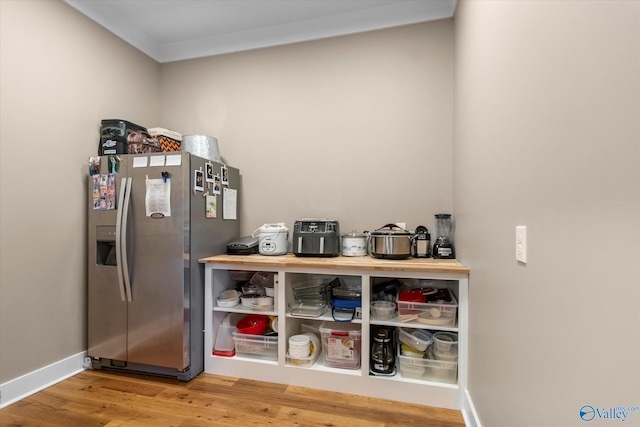 23784 Old Homeplace Way, Athens, AL 35613 - bar with stainless steel fridge with ice dispenser, wood finished floors, and baseboards