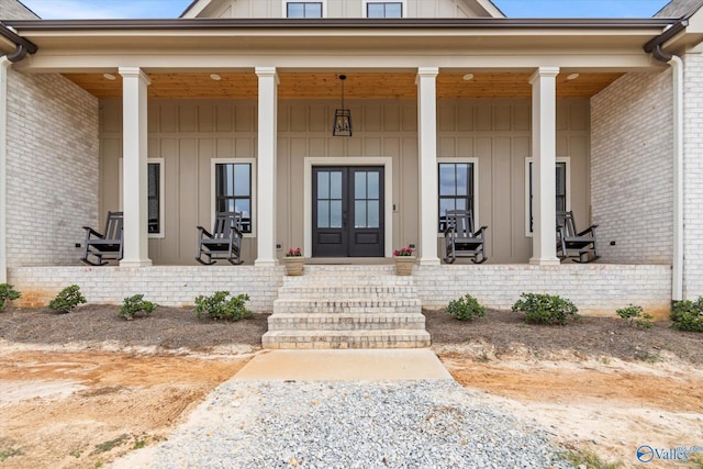 23784 Old Homeplace Way, Athens, AL 35613 - entrance to property with board and batten siding, covered porch, brick siding, and french doors