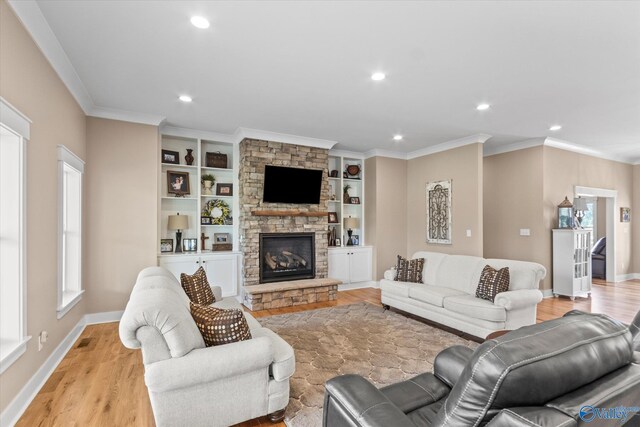 23784 Old Homeplace Way, Athens, AL 35613 - living room with light wood-style floors, a fireplace, recessed lighting, ornamental molding, and baseboards
