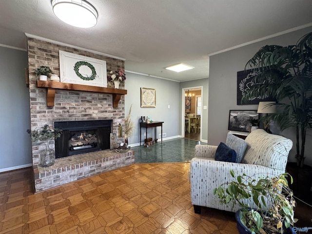 living area featuring baseboards, a fireplace, and crown molding