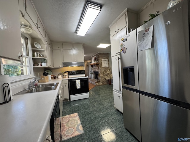 kitchen with under cabinet range hood, range with electric stovetop, a sink, light countertops, and stainless steel refrigerator with ice dispenser