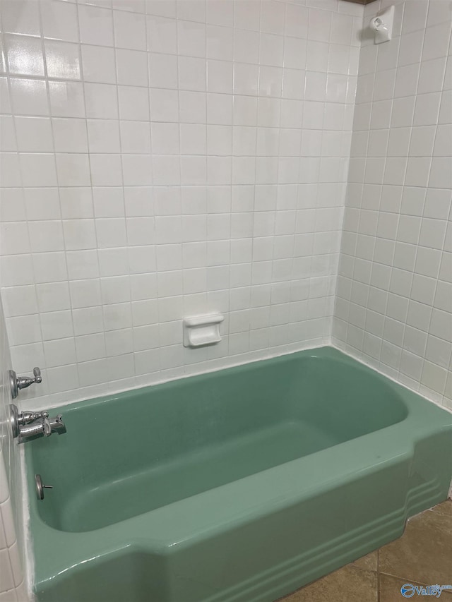 bathroom featuring shower / bath combination and tile patterned flooring