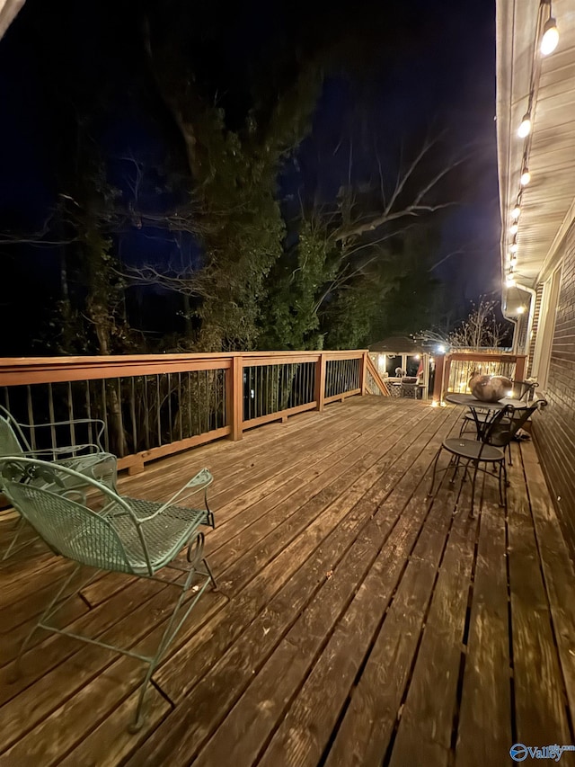 view of deck at twilight