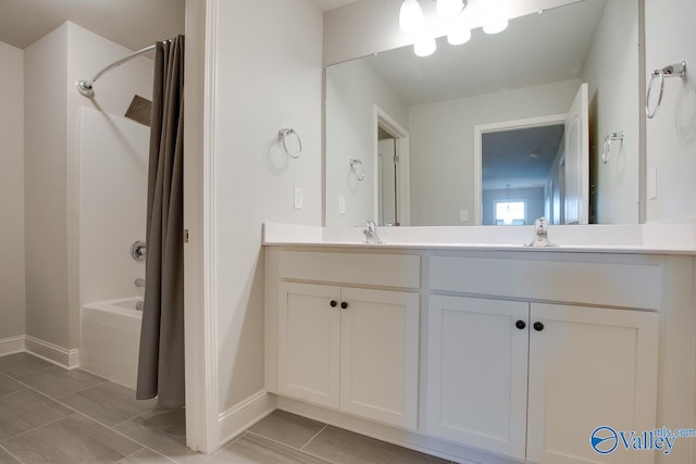 bathroom with shower / tub combo and vanity