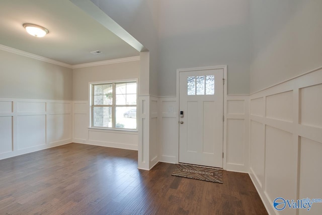 foyer featuring dark hardwood / wood-style flooring and crown molding