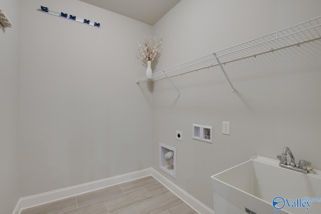 laundry area featuring washer hookup, electric dryer hookup, and sink