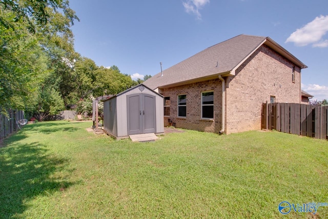 rear view of property featuring a shed and a lawn