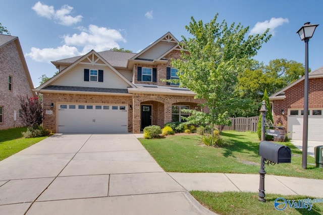 craftsman house featuring a garage and a front yard