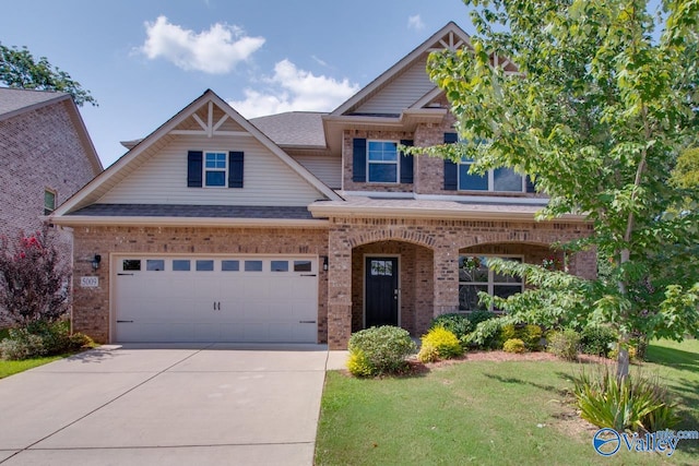 craftsman inspired home featuring a garage and a front yard