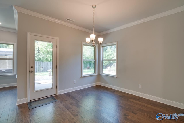 interior space featuring ornamental molding, a notable chandelier, and dark hardwood / wood-style floors