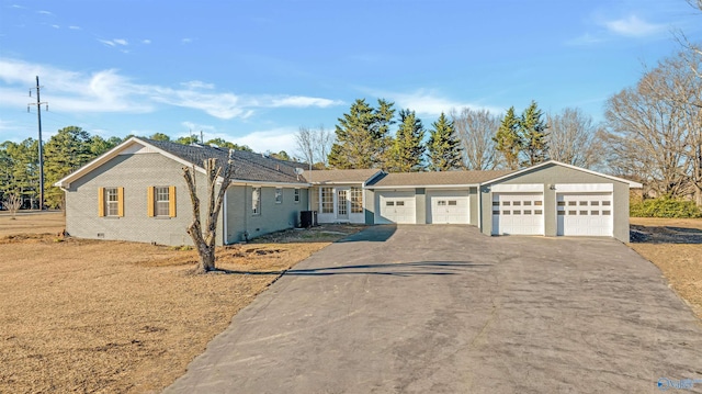 ranch-style house with crawl space, a garage, aphalt driveway, and brick siding