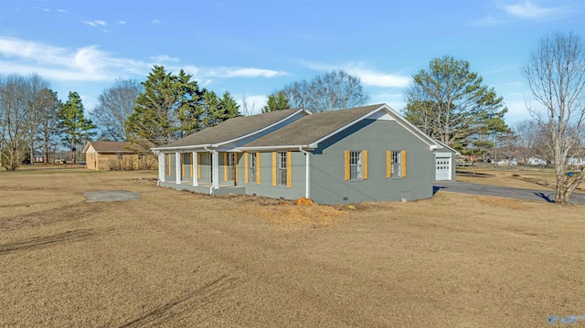 view of front of property featuring crawl space and brick siding