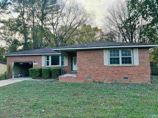 view of front of house with a garage and a front lawn