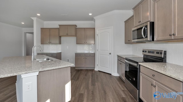 kitchen with stainless steel appliances, a center island with sink, sink, dark hardwood / wood-style floors, and light stone countertops