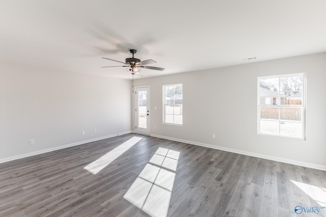 empty room featuring ceiling fan and hardwood / wood-style flooring