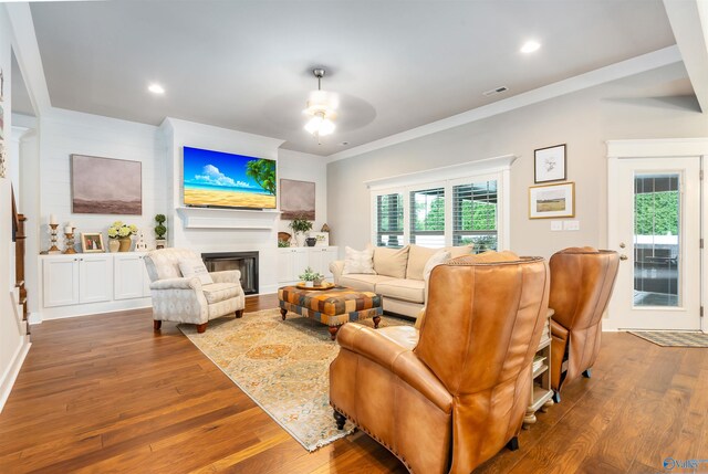 20009 Capitol Hill Dr, Tanner, AL 35671 - living room with a ceiling fan, wood finished floors, a fireplace, recessed lighting, and ornamental molding