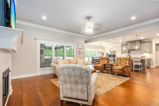 20009 Capitol Hill Dr, Tanner, AL 35671 - living room with ceiling fan, a fireplace, crown molding, hardwood / wood-style floors, and recessed lighting