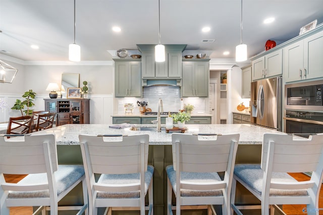 20009 Capitol Hill Dr, Tanner, AL 35671 - kitchen with built in microwave, stainless steel refrigerator with ice dispenser, light stone countertops, hanging light fixtures, and recessed lighting