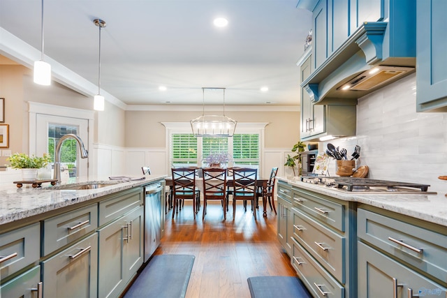 20009 Capitol Hill Dr, Tanner, AL 35671 - kitchen with a sink, stainless steel appliances, premium range hood, wainscoting, and crown molding